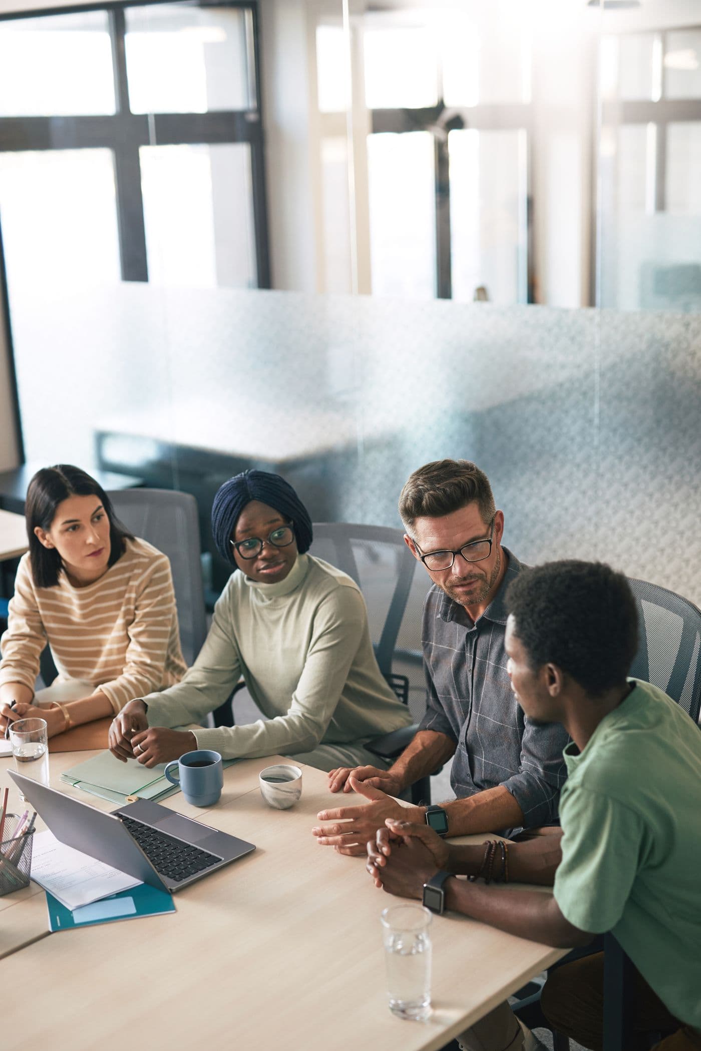 A modern engineering team collaborating in a bright office