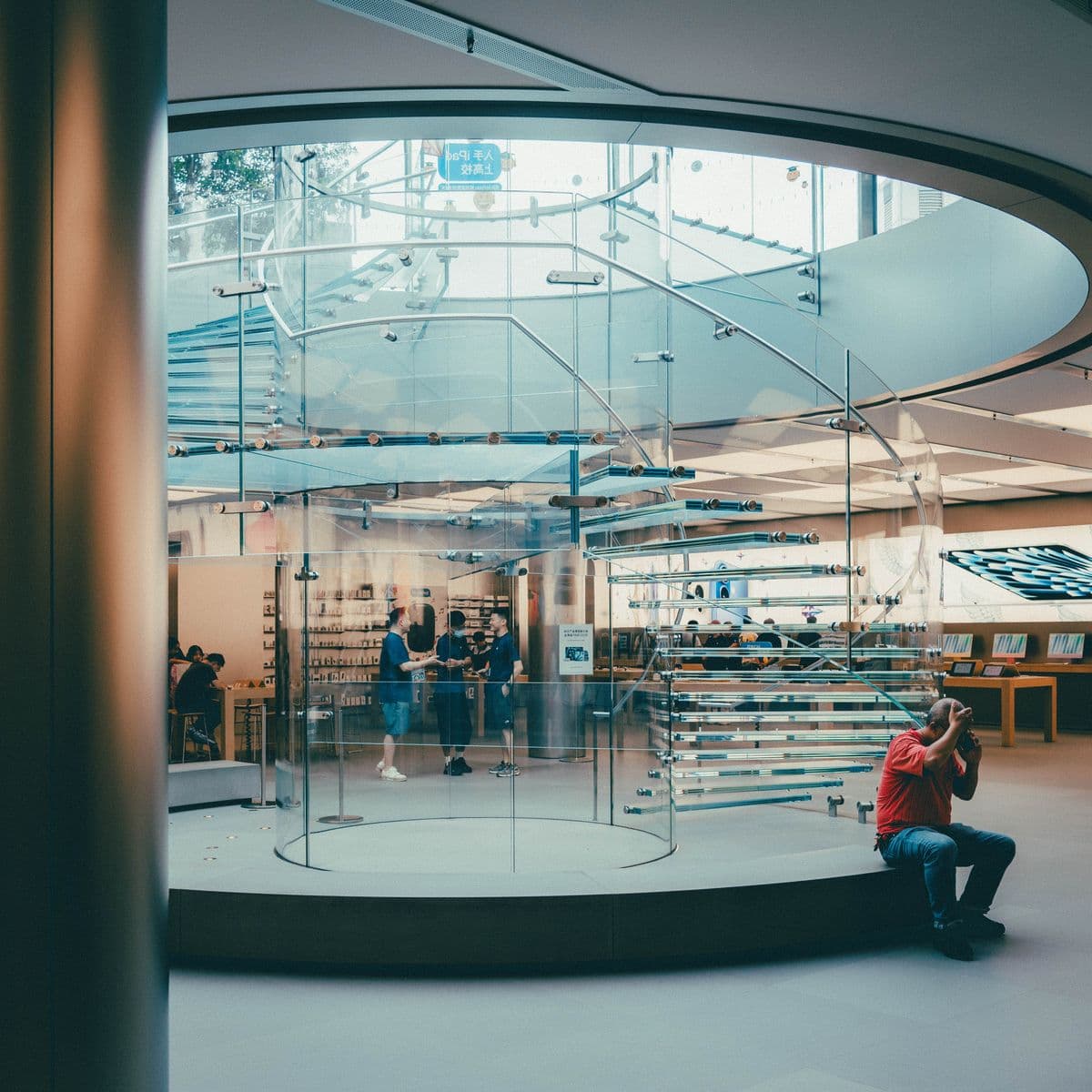Modern retail store interior with a glass staircase