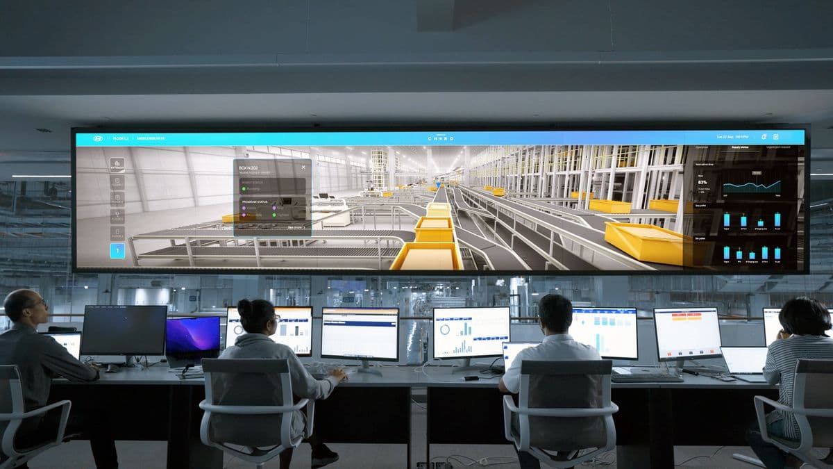 Operators monitoring production dashboards in a control room
